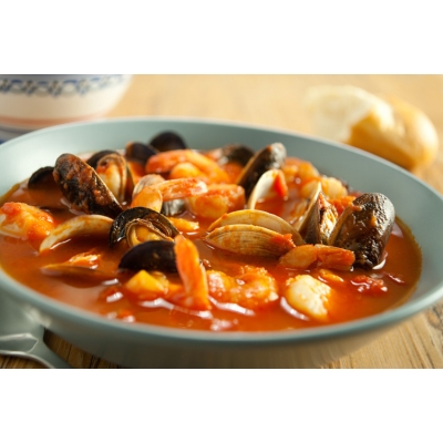 California seafood cioppino in a saffron broth with garlic & basil