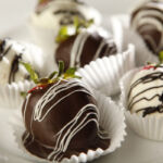 Chocolate-covered strawberries on each table