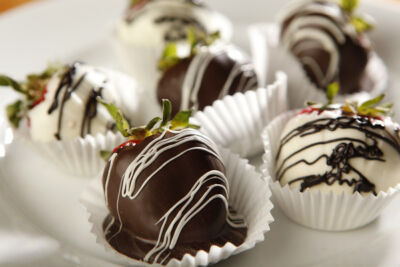 Chocolate-covered strawberries on each table
