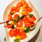 Ripe tomatoes with fresh mozzarella & basil salad